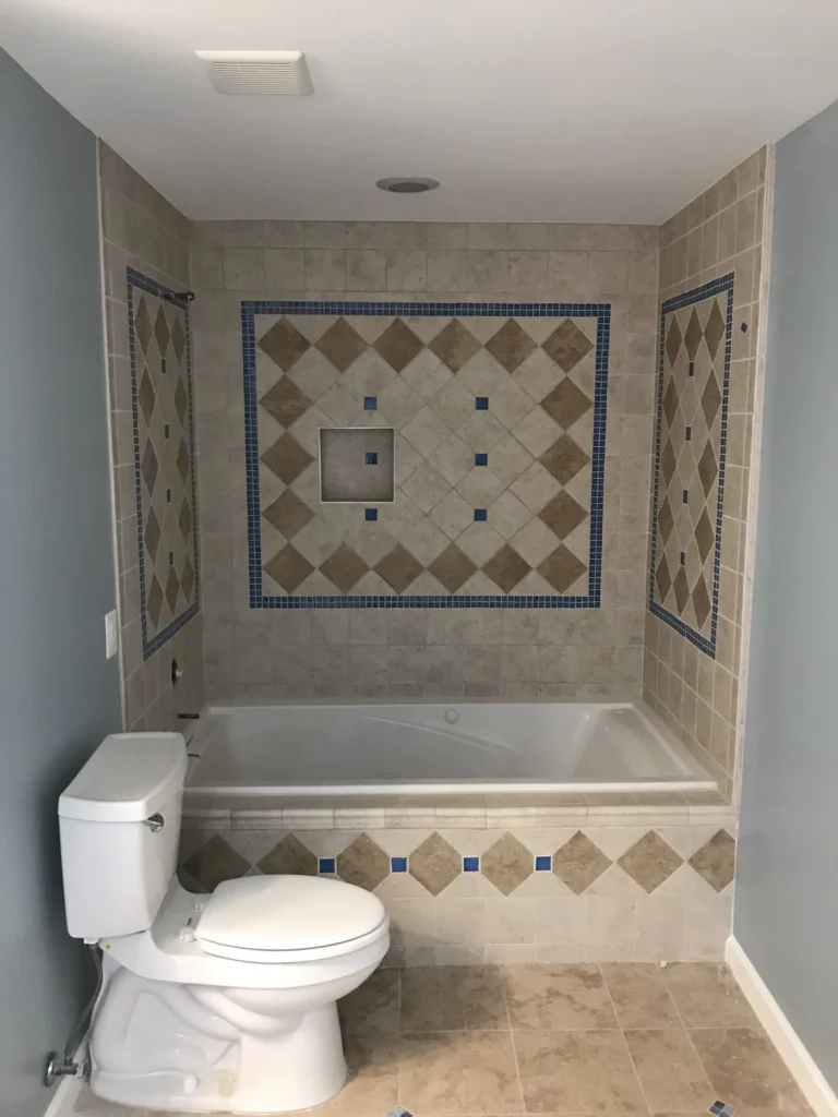 Bathtub surround with a decorative diamond tile inlay